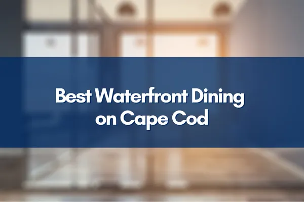 Scenic Cape Cod waterfront with dining tables overlooking the water, perfect for a relaxing meal.