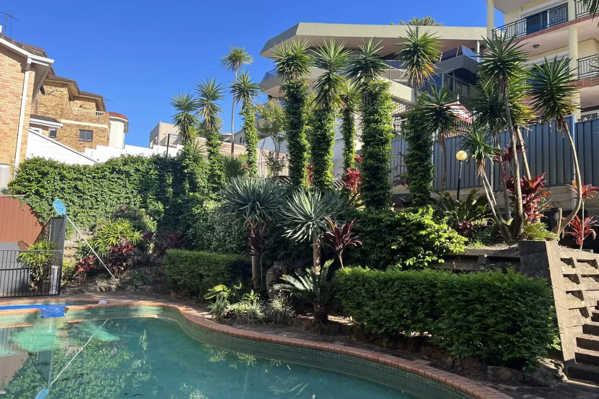 Professional estate garden maintenance featuring precision-trimmed hedges and manicured lawns for a luxury property in Vaucluse