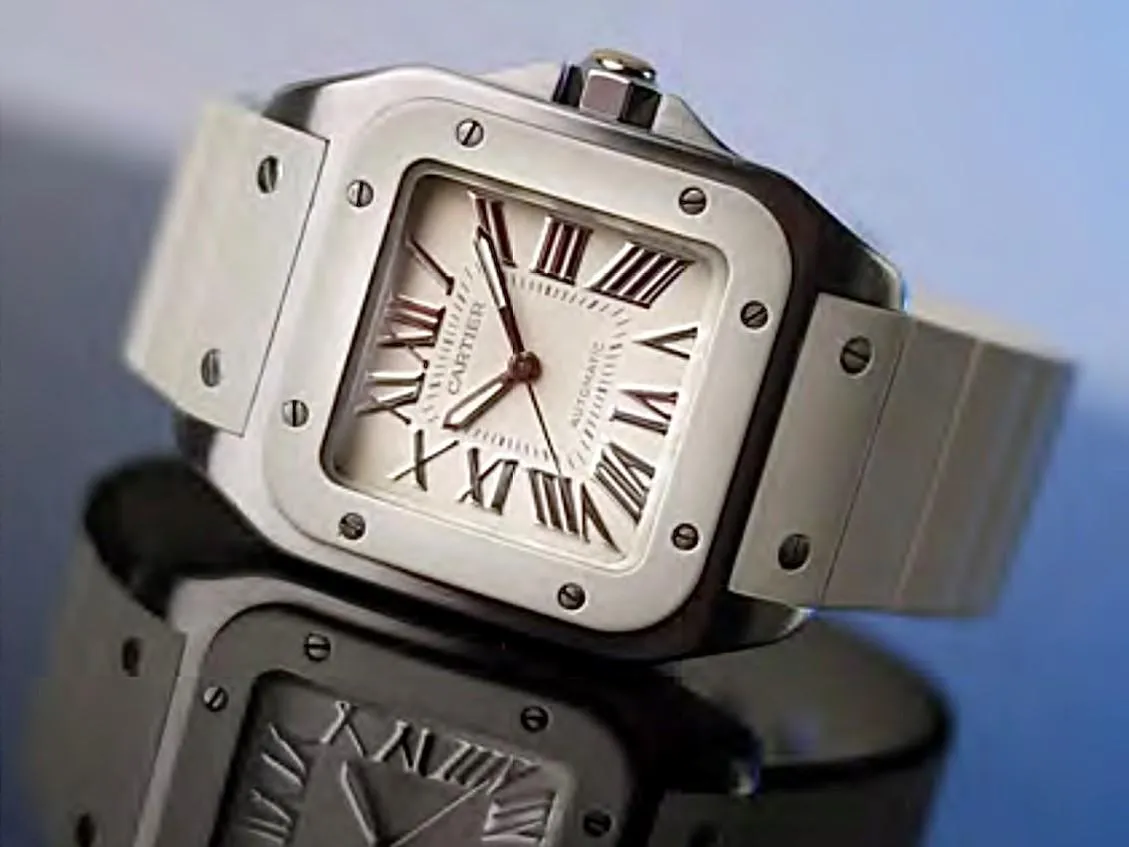 three round silver-colored chronograph watches on white mounts