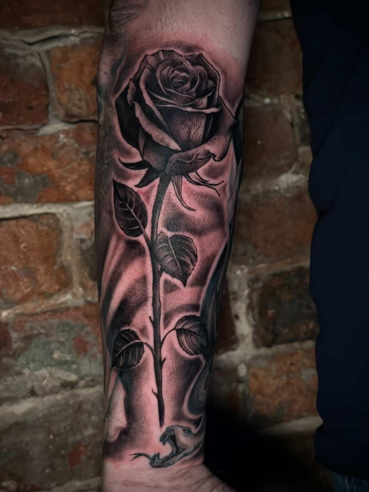 person with tattoo on right arm