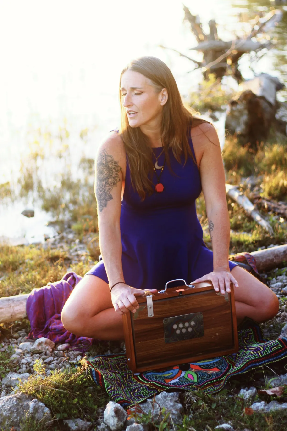 Serene seaside altar with woven cloth, bowls, and natural props in warm natural light.