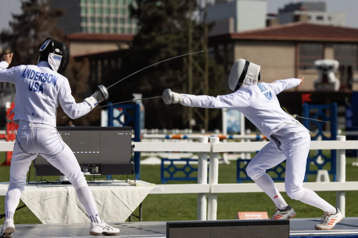 Two People Fencing