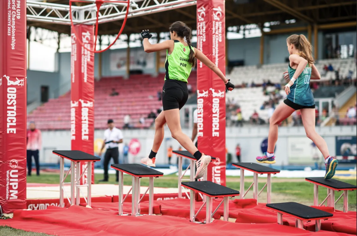 Two People Completing An Obstacle Course