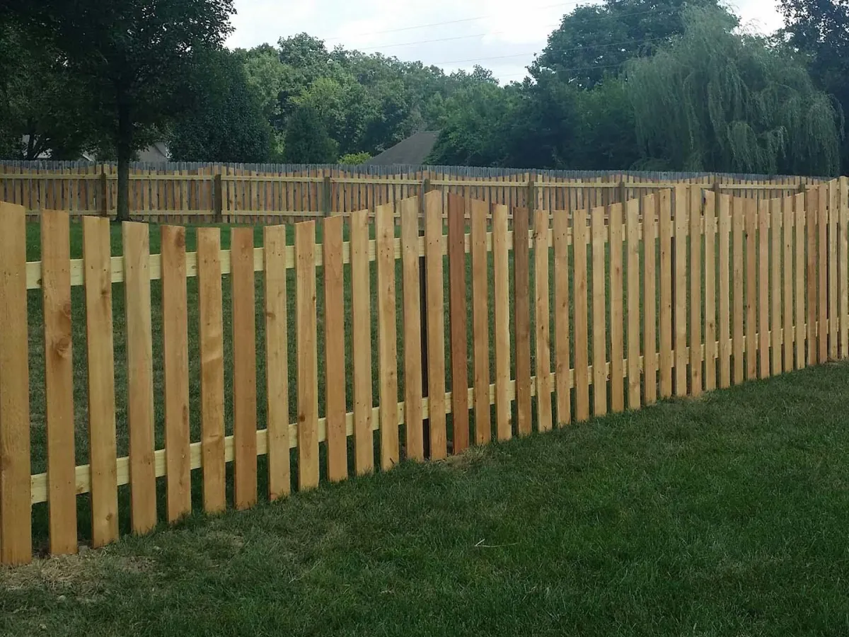 a wooden fence in front yard