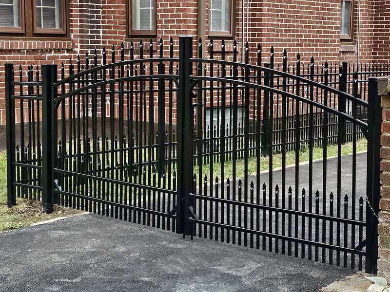 a wrought iron fence of a building