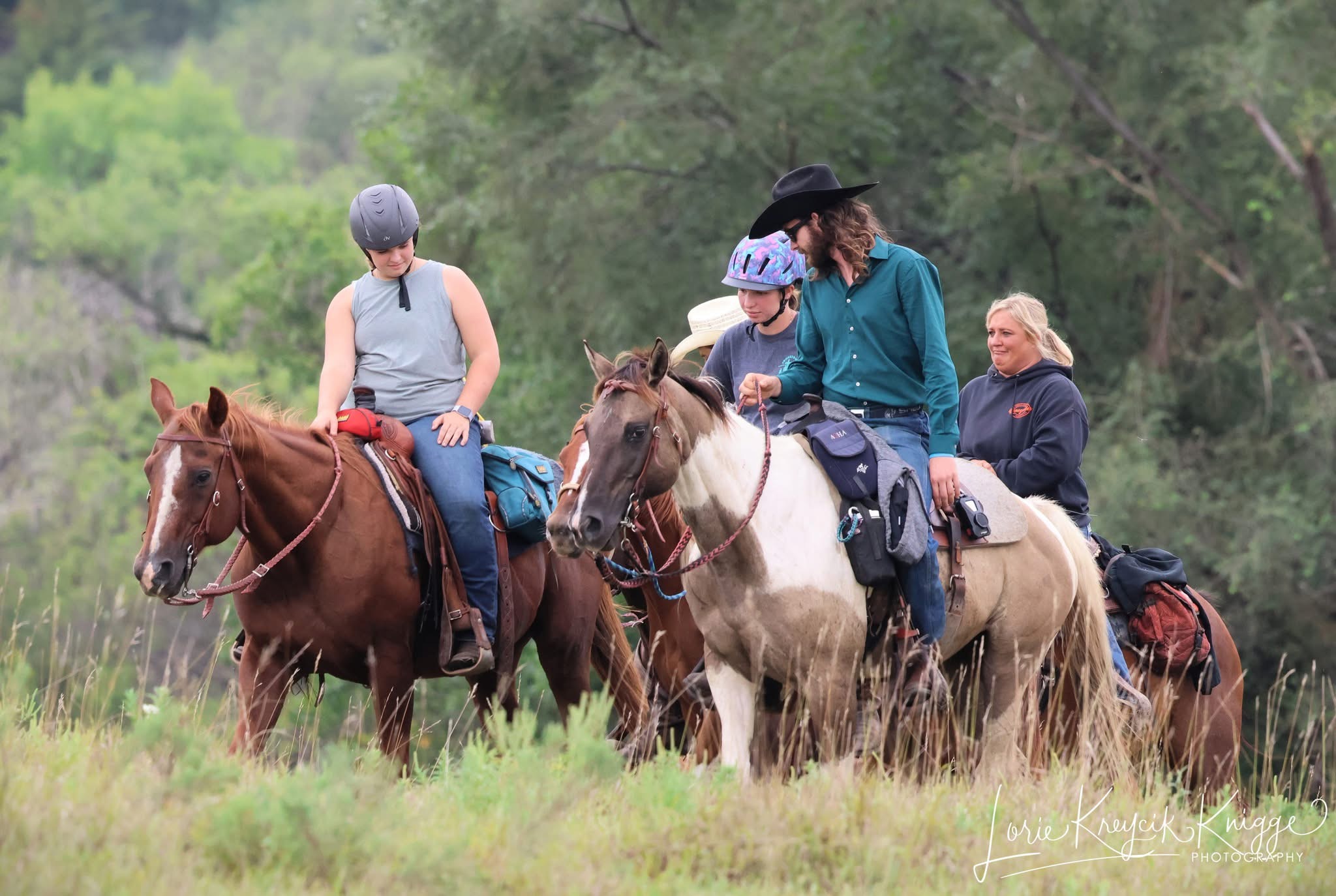 A gentle moment of connection between a young rider and a horse