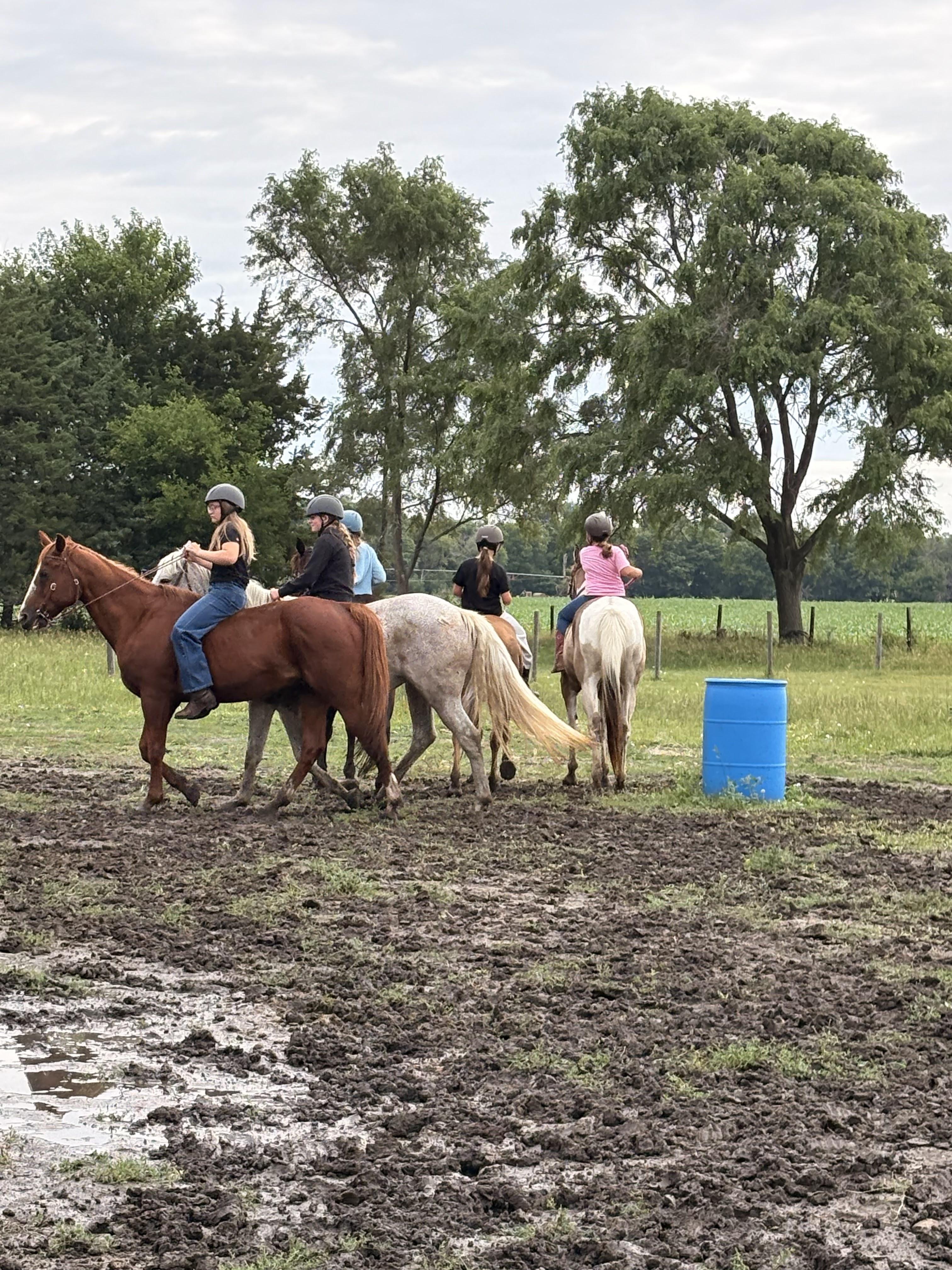 Photorealistic photo of three kids (ages 12, 14, 15) riding horses