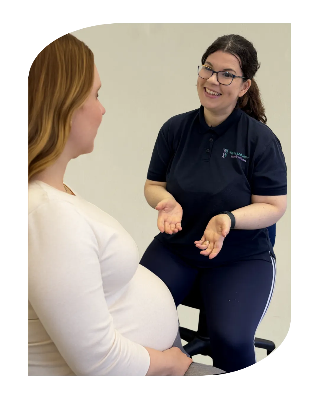Roberta Bass Smiling talking to pregnant patient