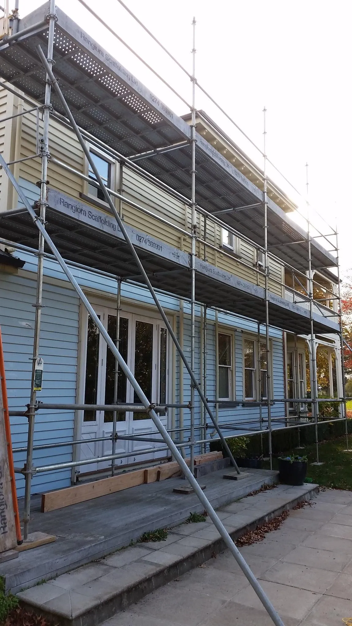 Scaffolding installed by Rangiora Scaffolding Limited on a two-storey weatherboard home for exterior maintenance or painting access