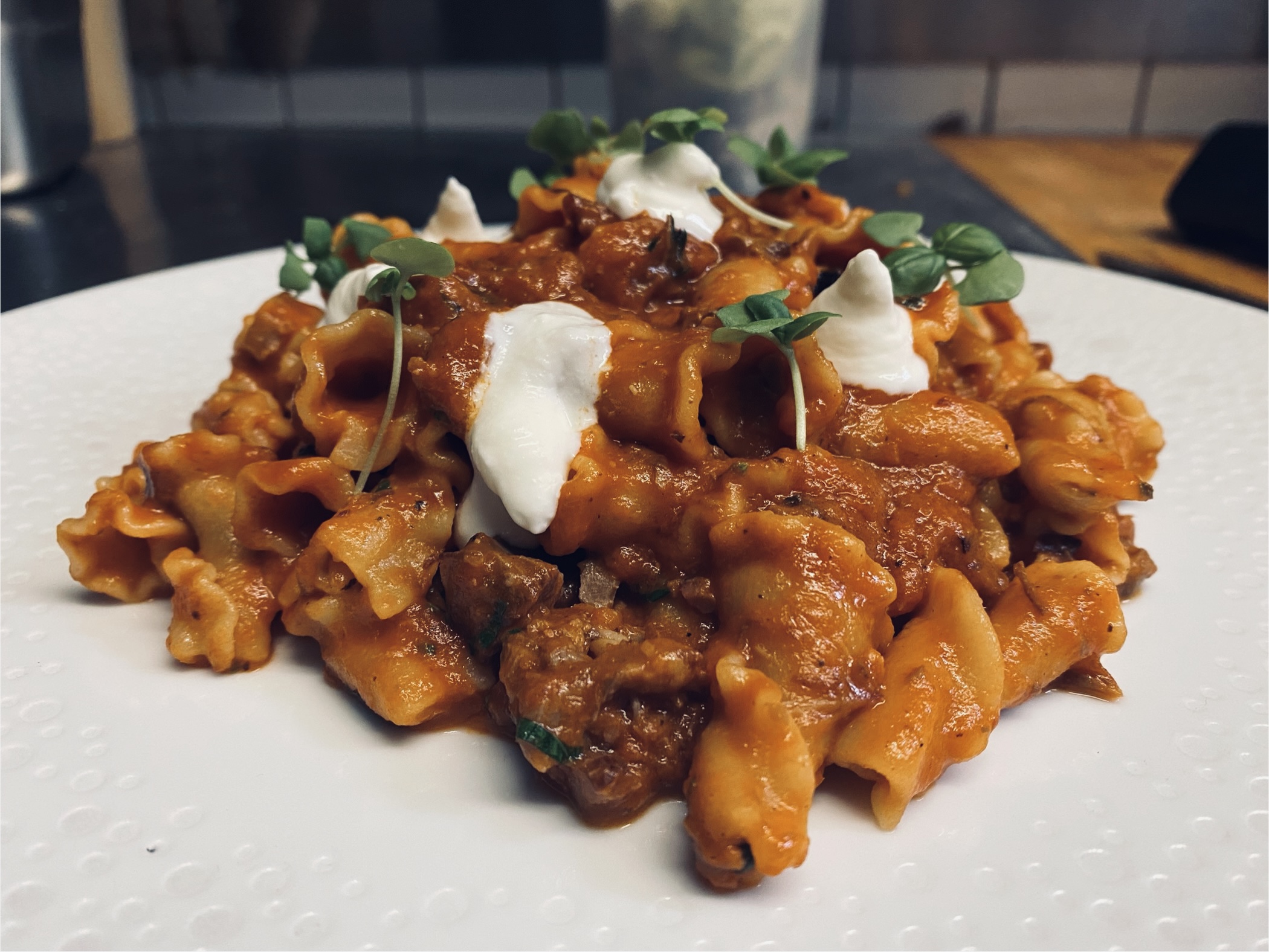 six white and brown eggs on white towel