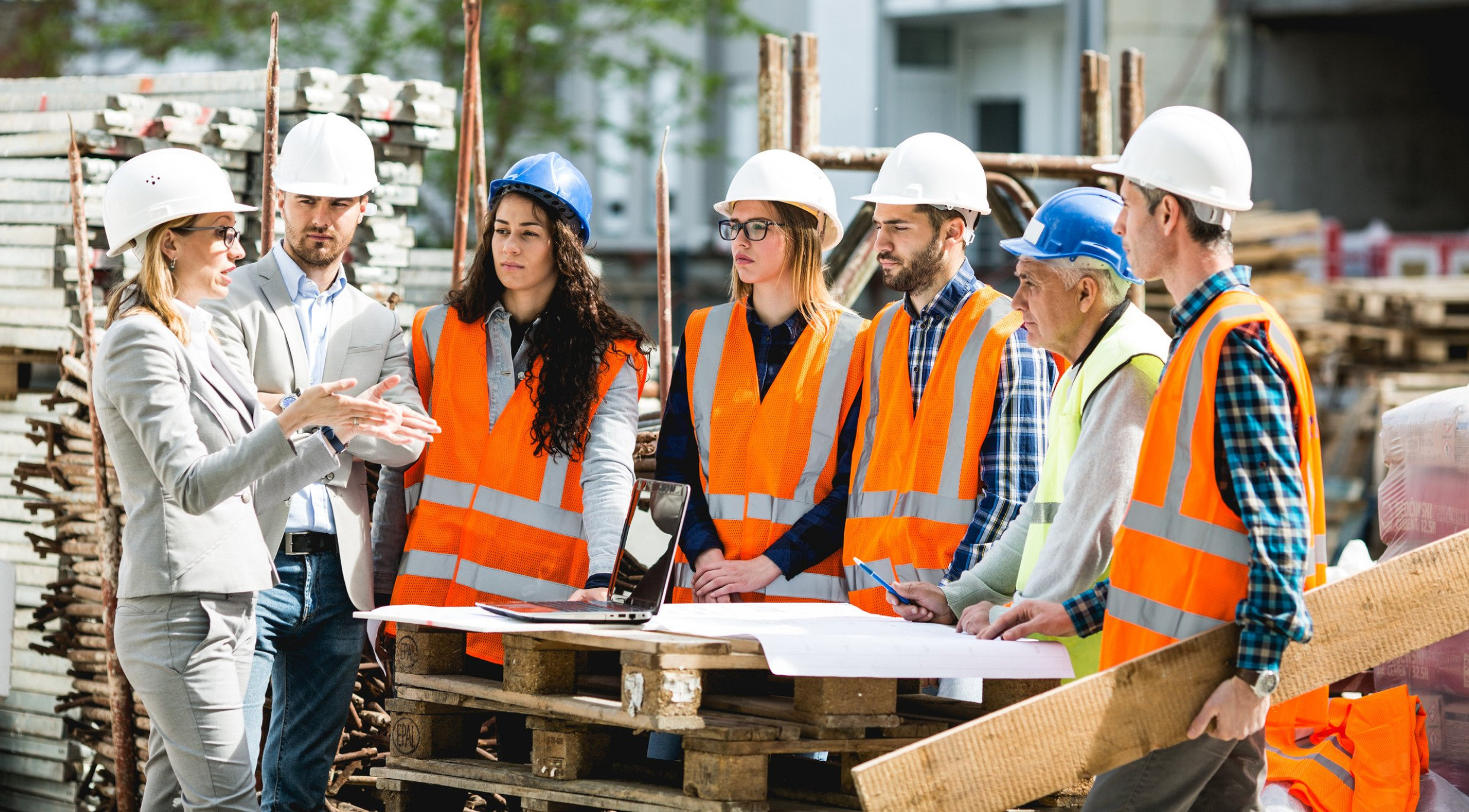 Team of workers discussing removal and site cleanup project