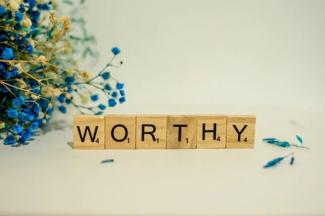 worthy spelled in scrabble letters