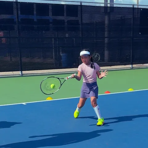 Junior tennis forehand drill at Zenniq Academy – girl developing technique, coordination and footwork with cones in Katy, Texas