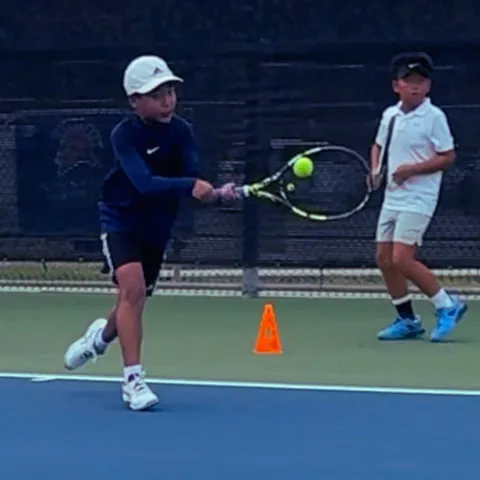Junior tennis forehand drill with focus and precision – Zenniq Academy kids training footwork and technique in Katy, Texas