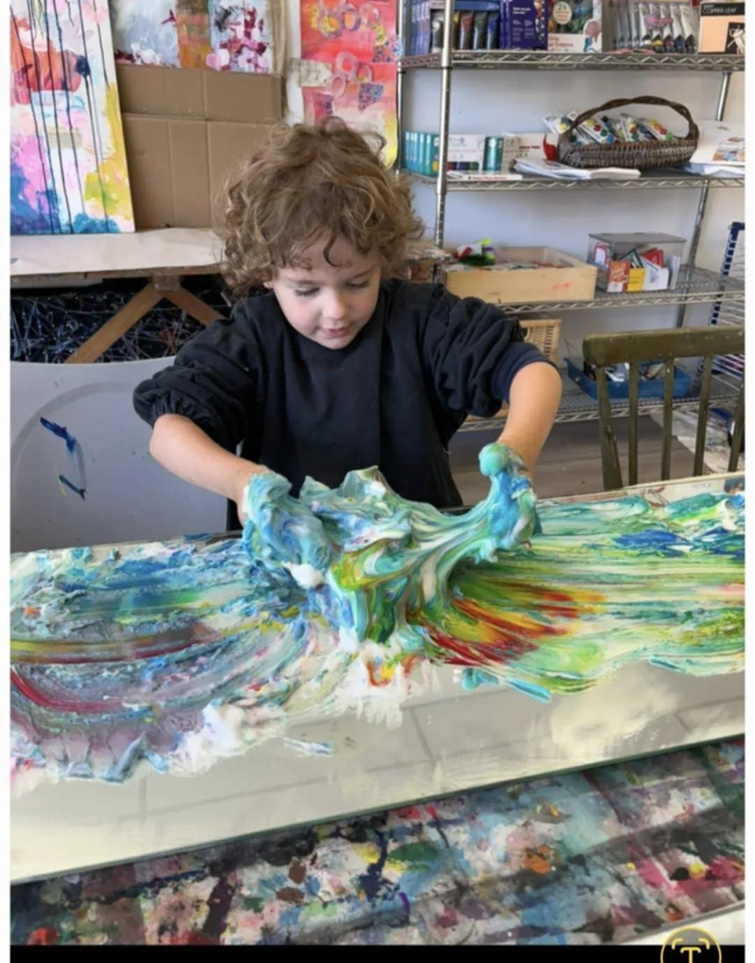 Portrait of a smiling mother holding a framed child collage