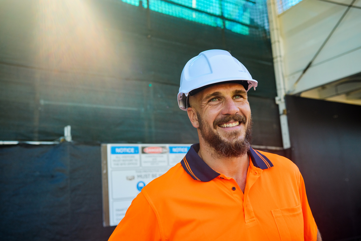 Tradesman looking happy on site