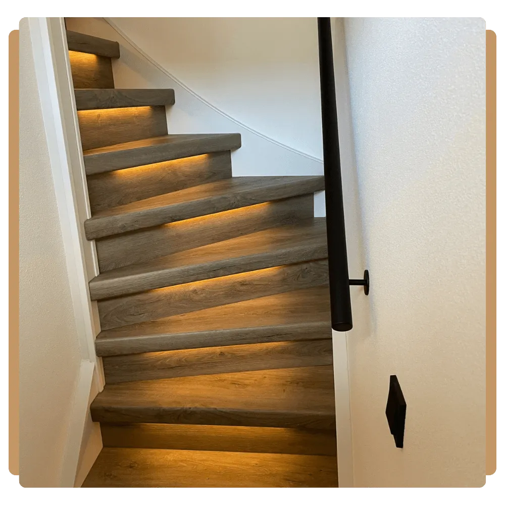 a stairway leading up to a yellow wall
