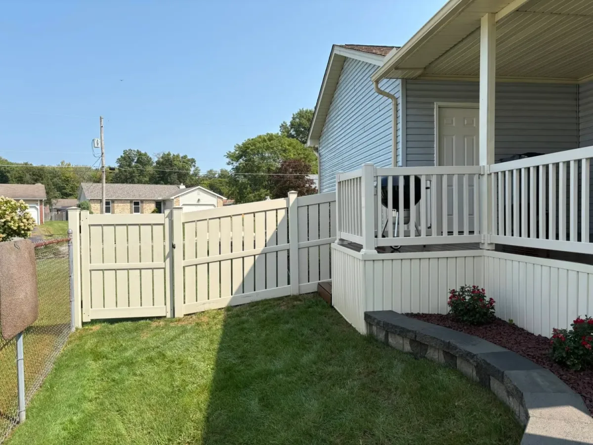 A white picket fence looks brilliant, clean, and good as new after being washed. 