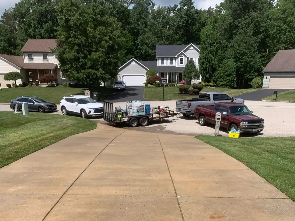 A long driveway has just received a deep clean, and looks stain-free.