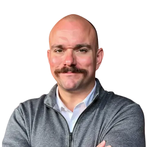 John The Marketer headshot in a grey hoodie