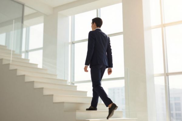 man walking up stairs