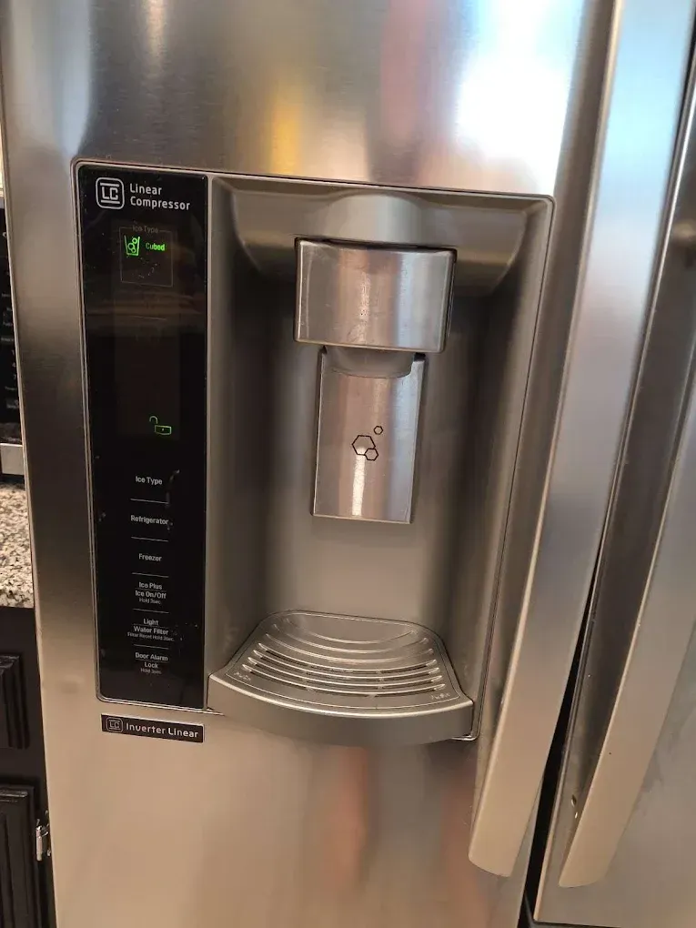 A fast-response appliance repair technician promptly diagnosing a residential kitchen refrigerator unit on the same day in Turlock, CA near the Geer Road corridor.