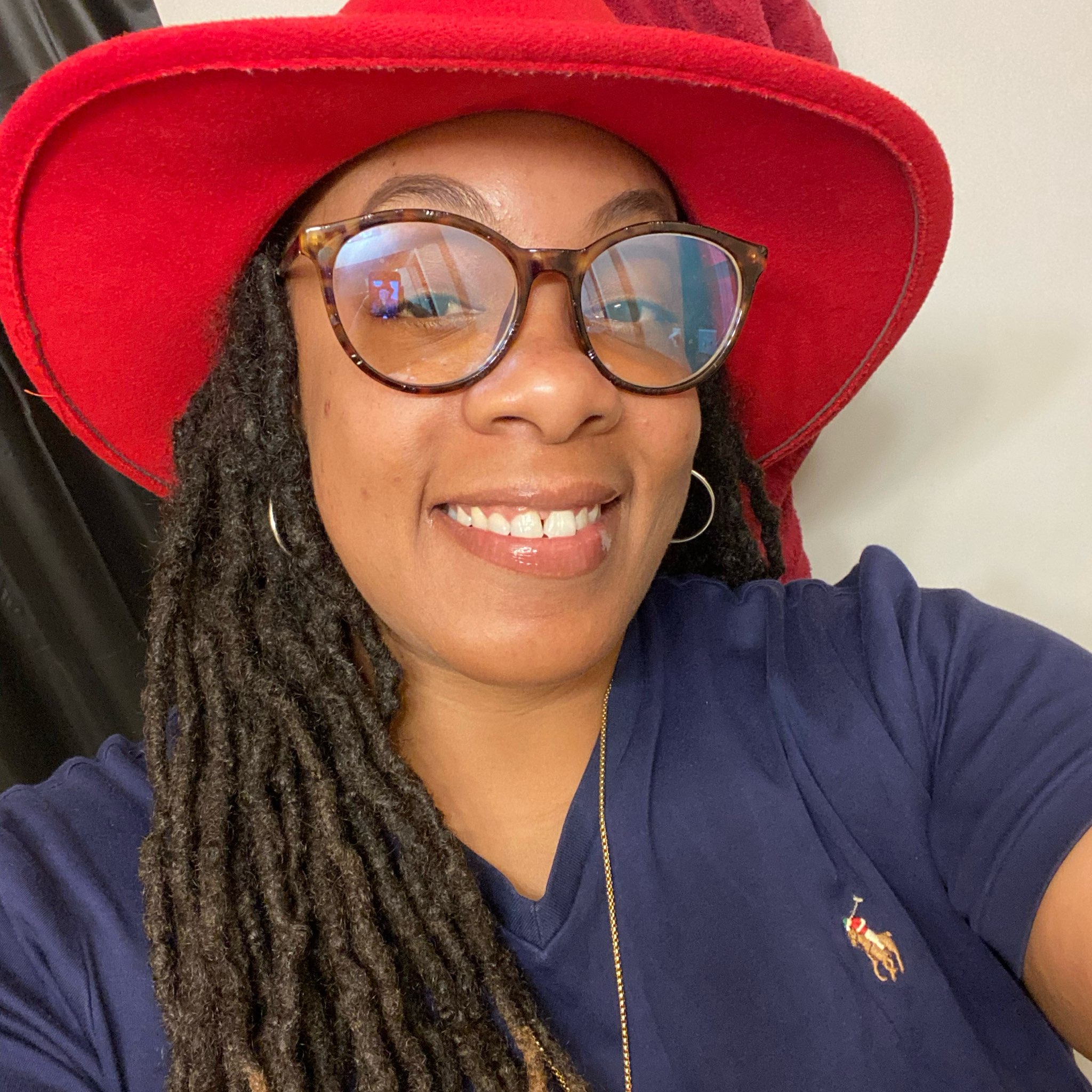 Barbers and clients laughing and talking in a modern shop