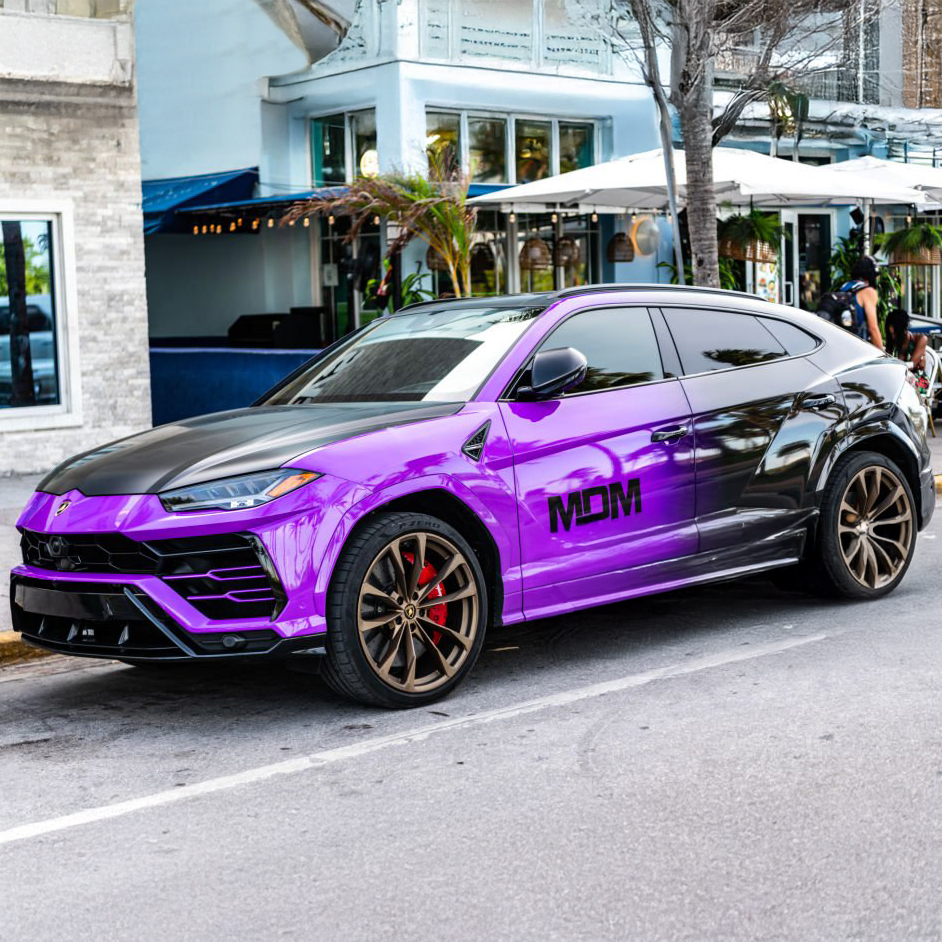 Luxury vehicle color change wrap service in South Florida featuring custom purple finish