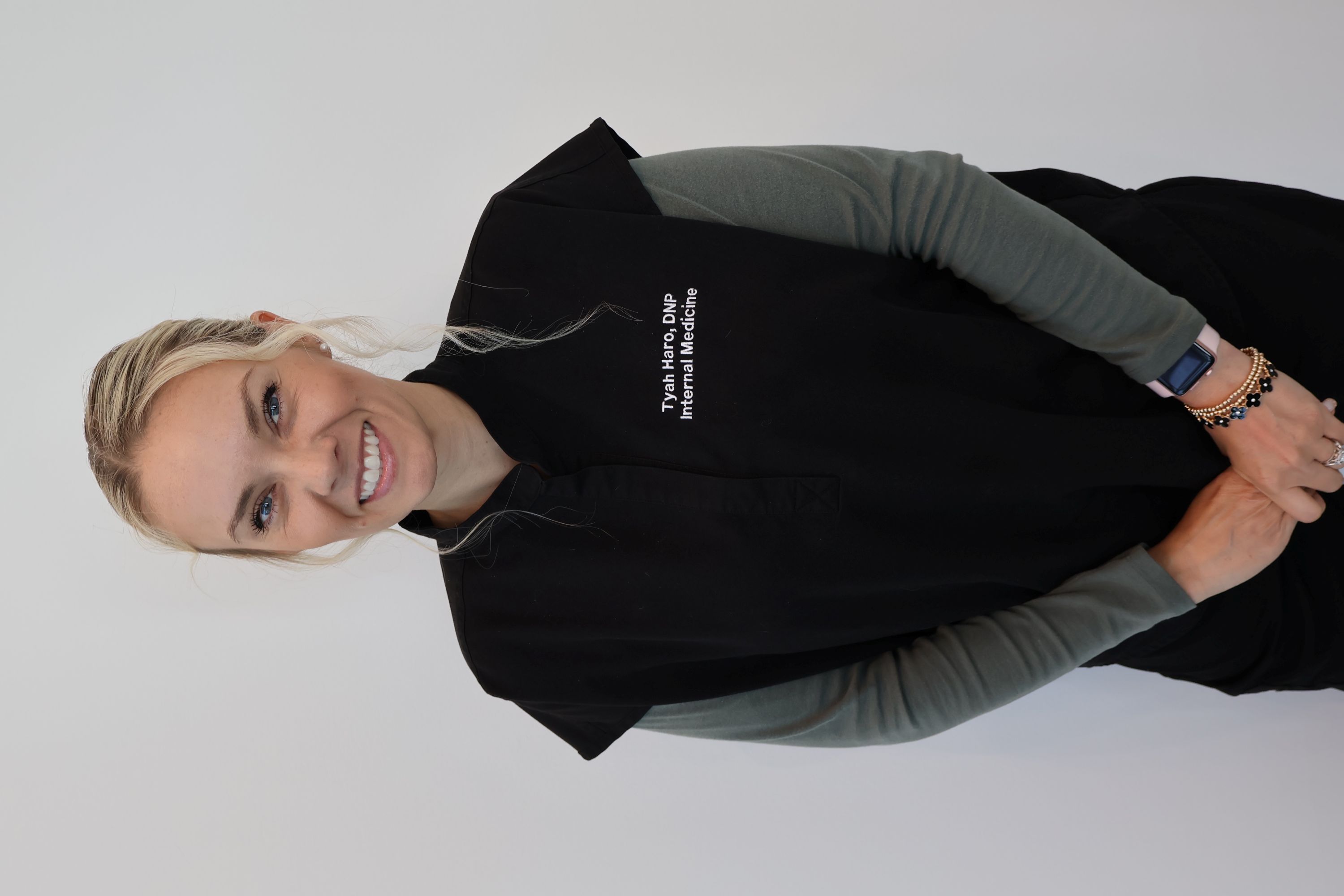 Editorial portrait of female functional medicine clinician in a serene, naturally lit clinical study