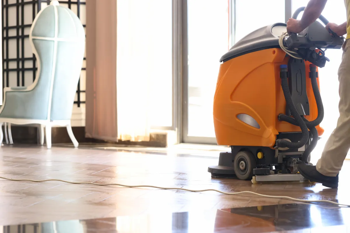 Machine scrubbing tiled floor