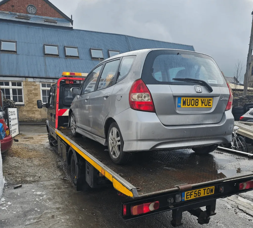 Our recovery vehicle taking a car to the scrap yard
