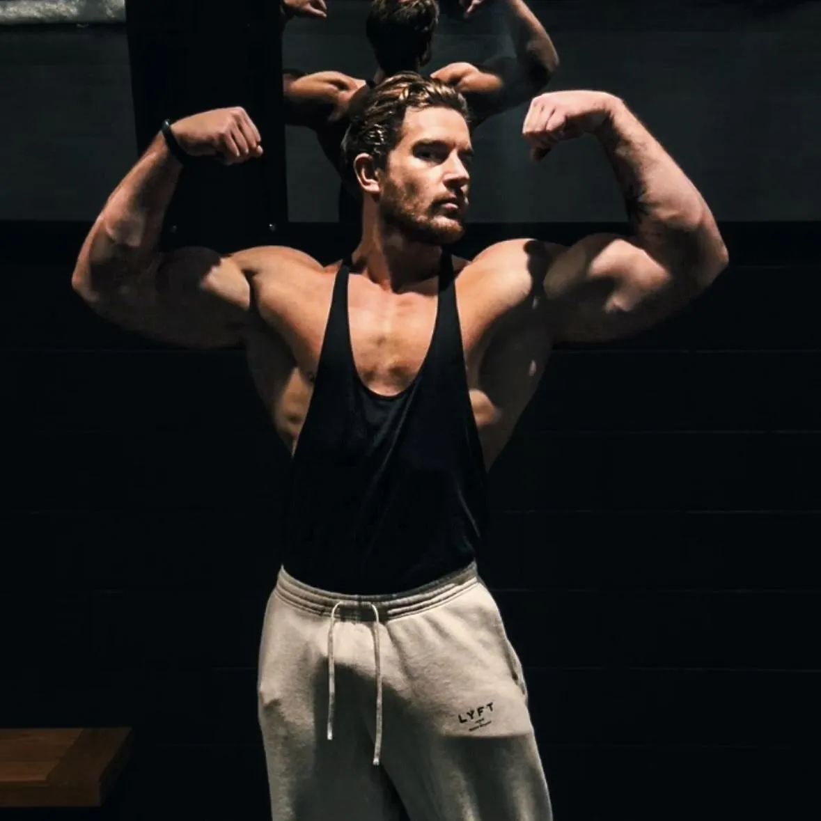 person wearing gray tank top