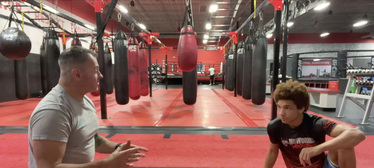 Lou Campasano coaching a young athlete through return to play