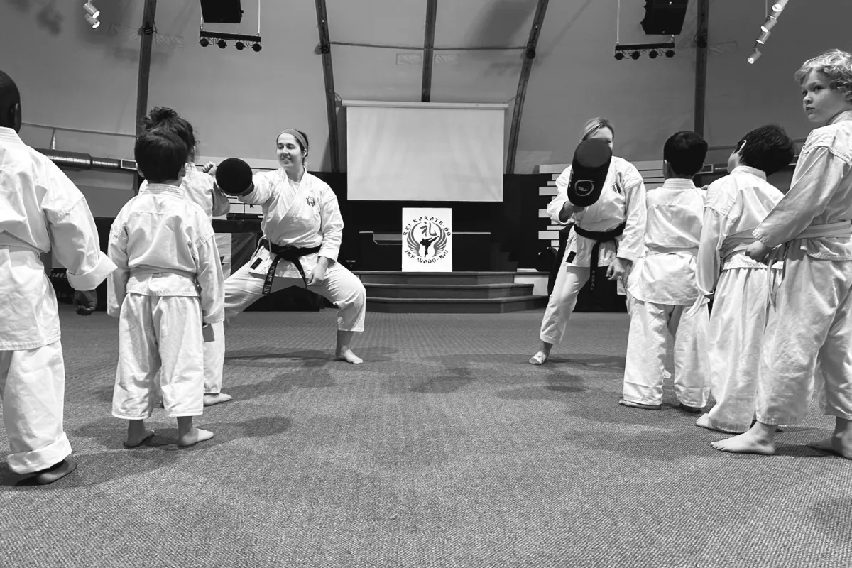 Young children in karate gi practicing Rei at Rei Karate in Barrie, fostering respect and discipline from a young age.