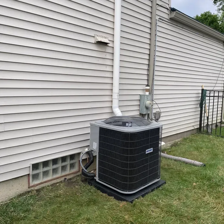 a bicycle parked next to a wall with a sign on it