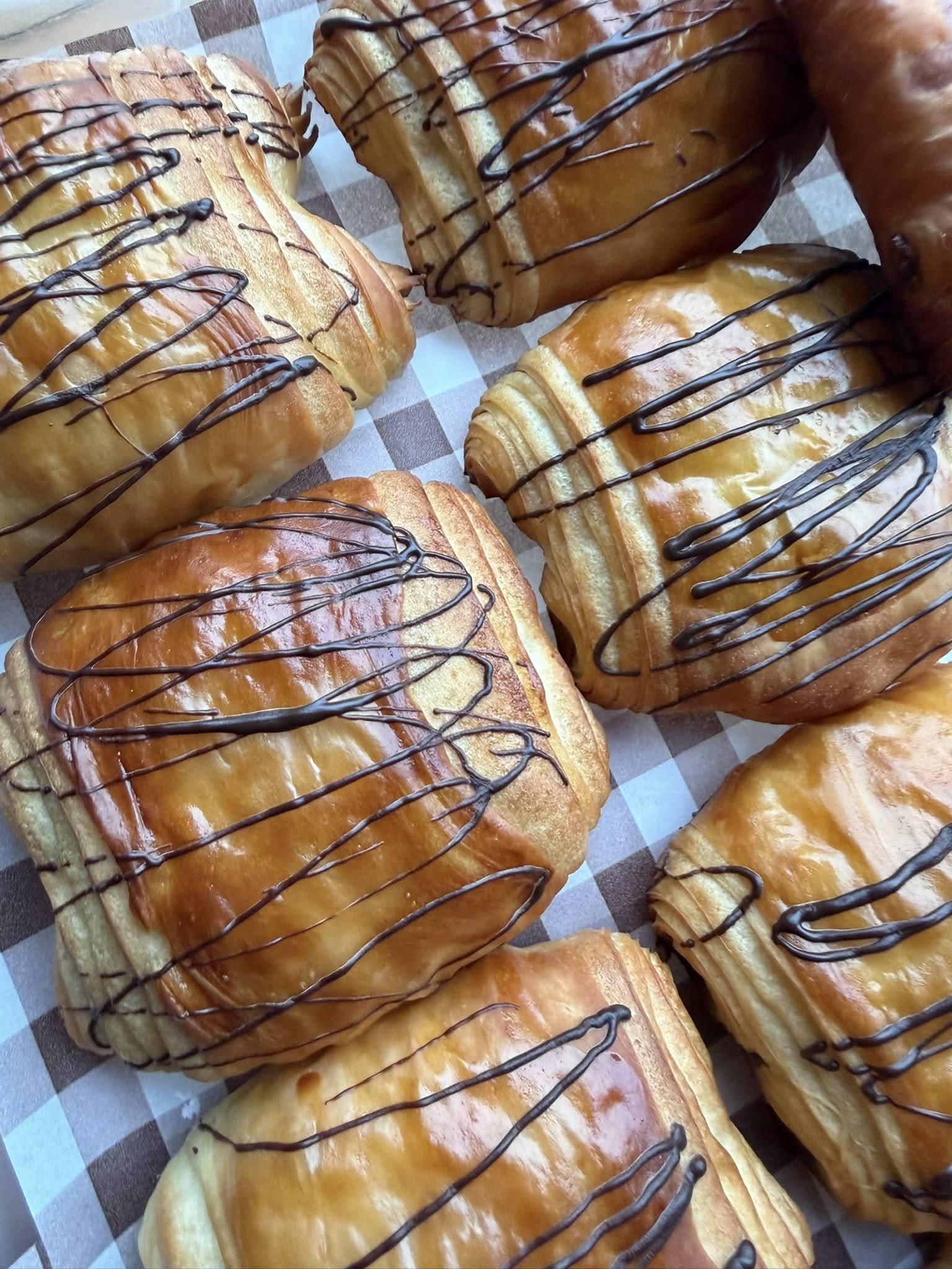 Square tile of stacked baguettes with golden crust and clean edge crop.
