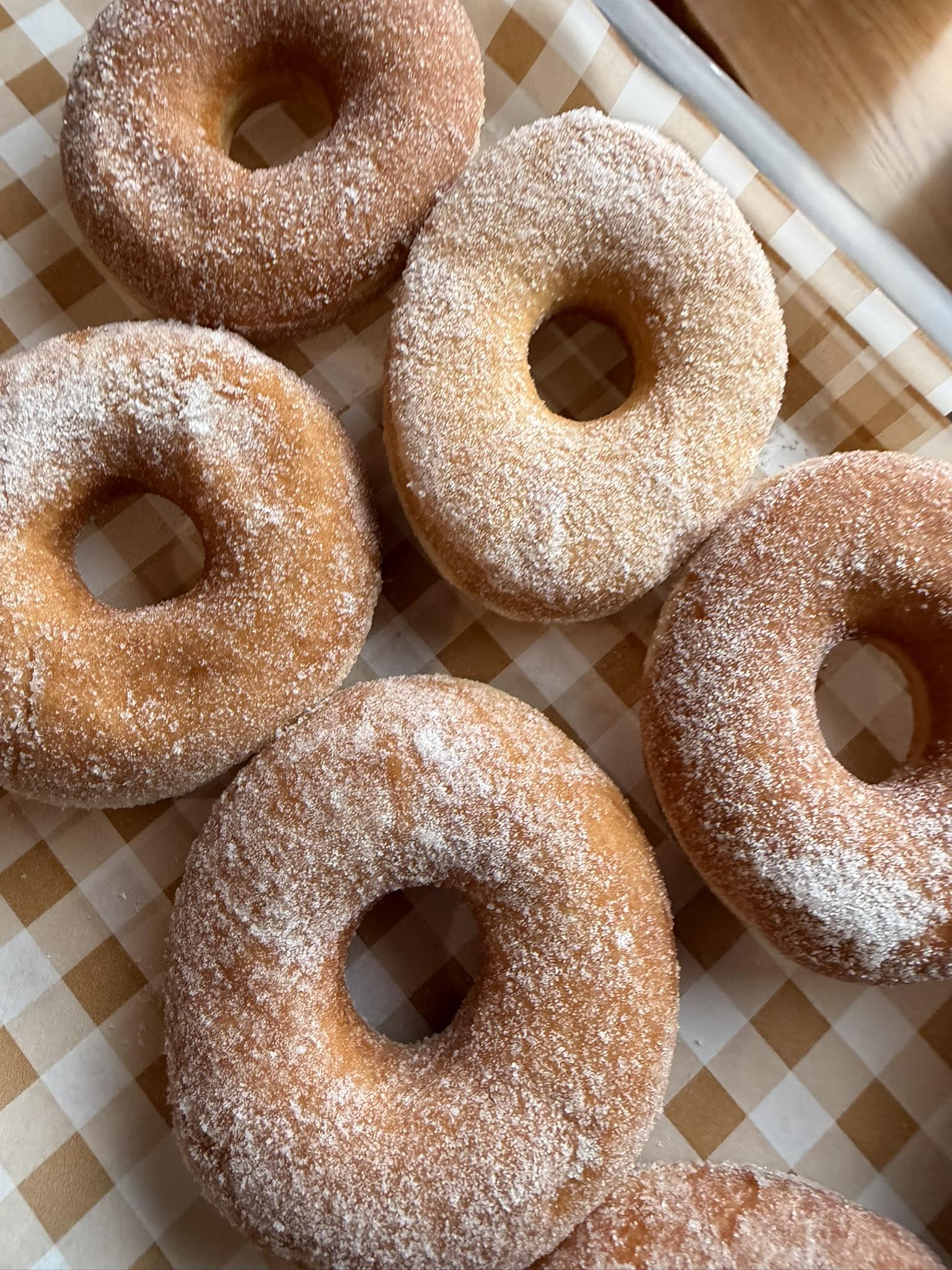 Close-up of a glazed pastry in morning light, square social tile.