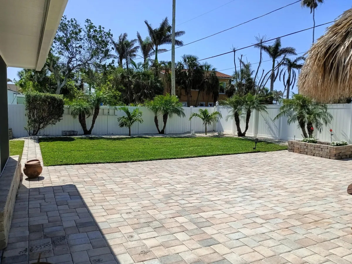 Backyard in Pinellas County with new landscaping after service.