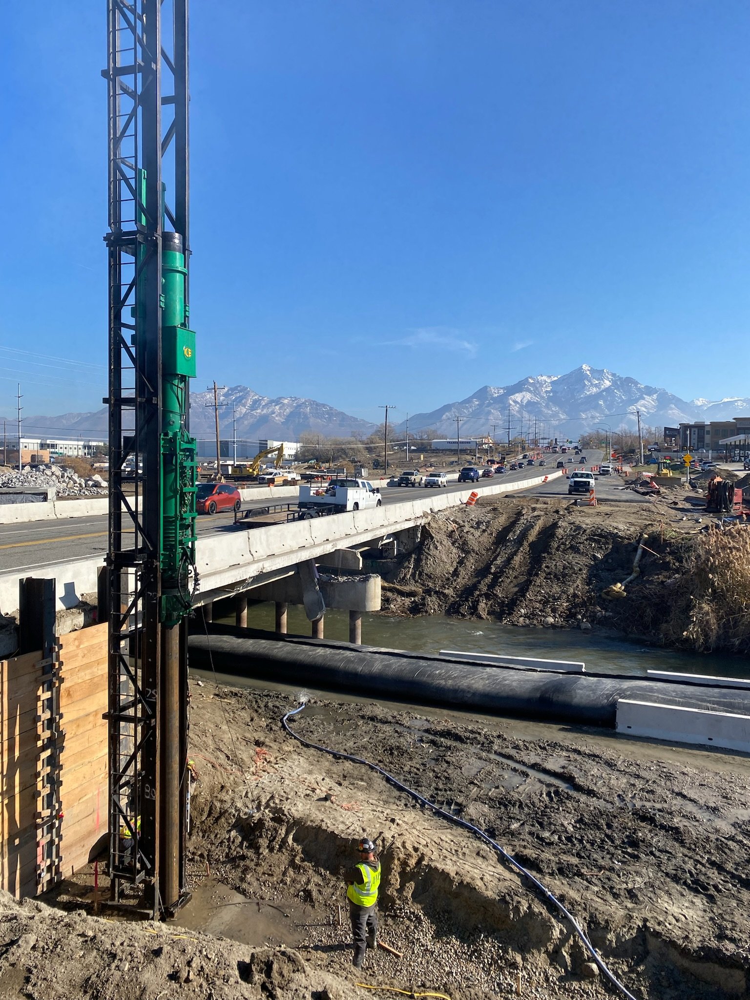 Soldier pile earth retention alongside a bridge structure on the Wasatch Front