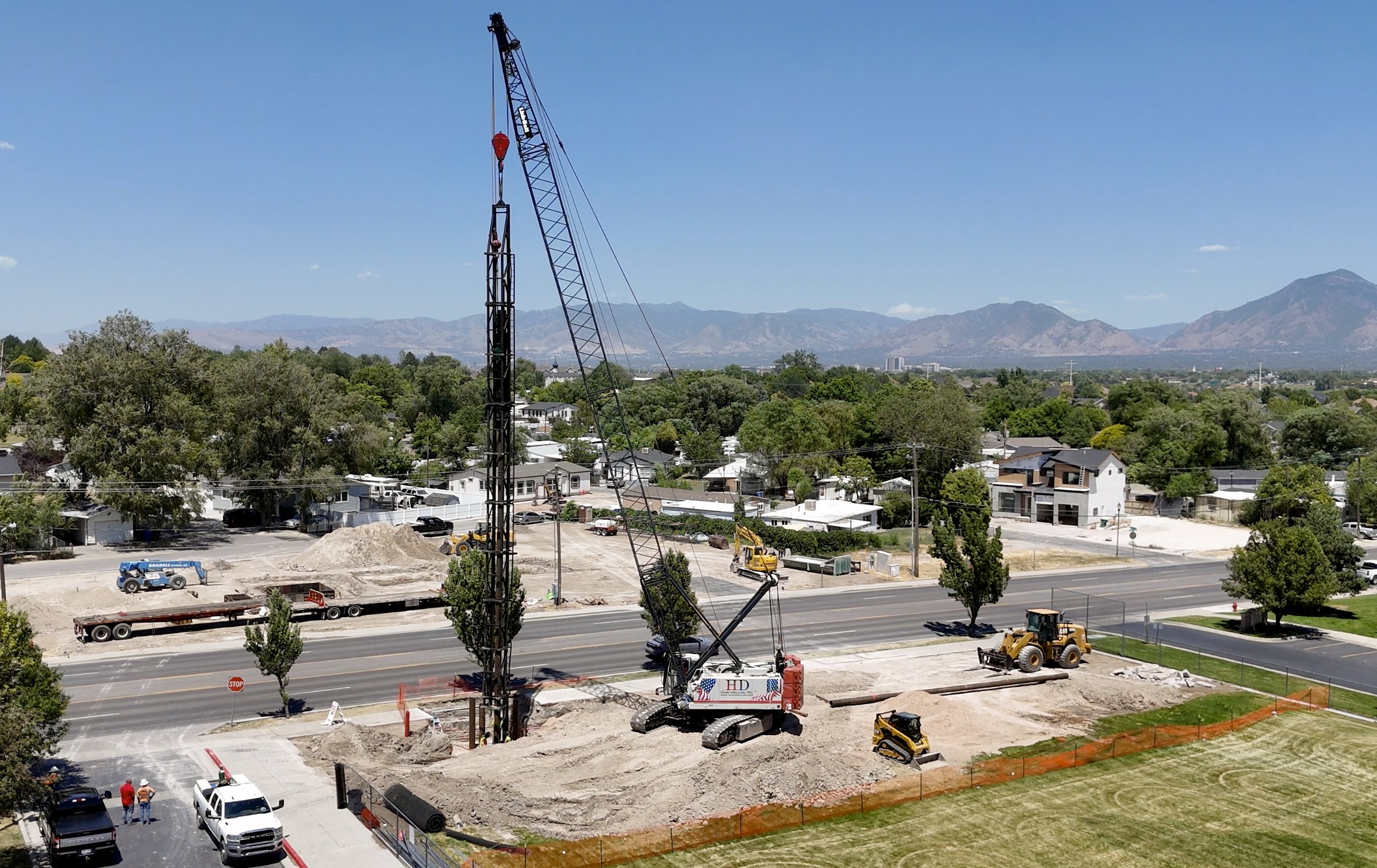 Crane and drill rig on an industrial foundation project near Salt Lake City