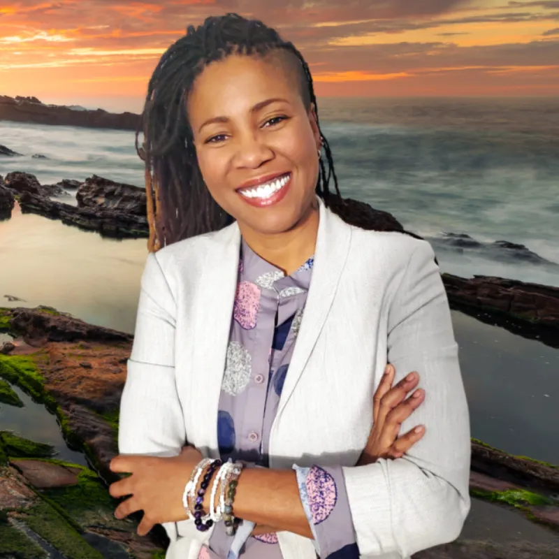 Photo of Kemiesh “Kei” Robb, end-of-life doula, in soft natural light