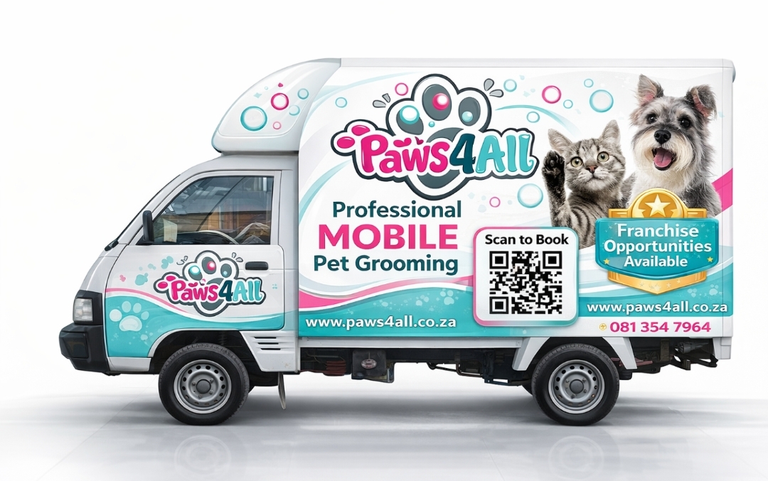 Groomer cuddling a relaxed dog after grooming