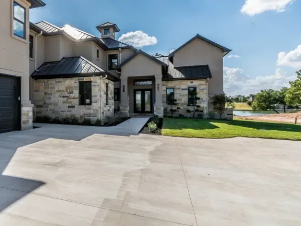 Luxury home with freshly cleaned driveway and yard
