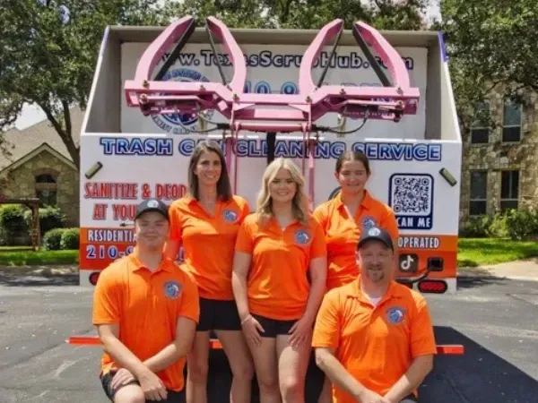 Texas Scrub Hub team standing in front of trash can cleaning truck in San Antonio TX