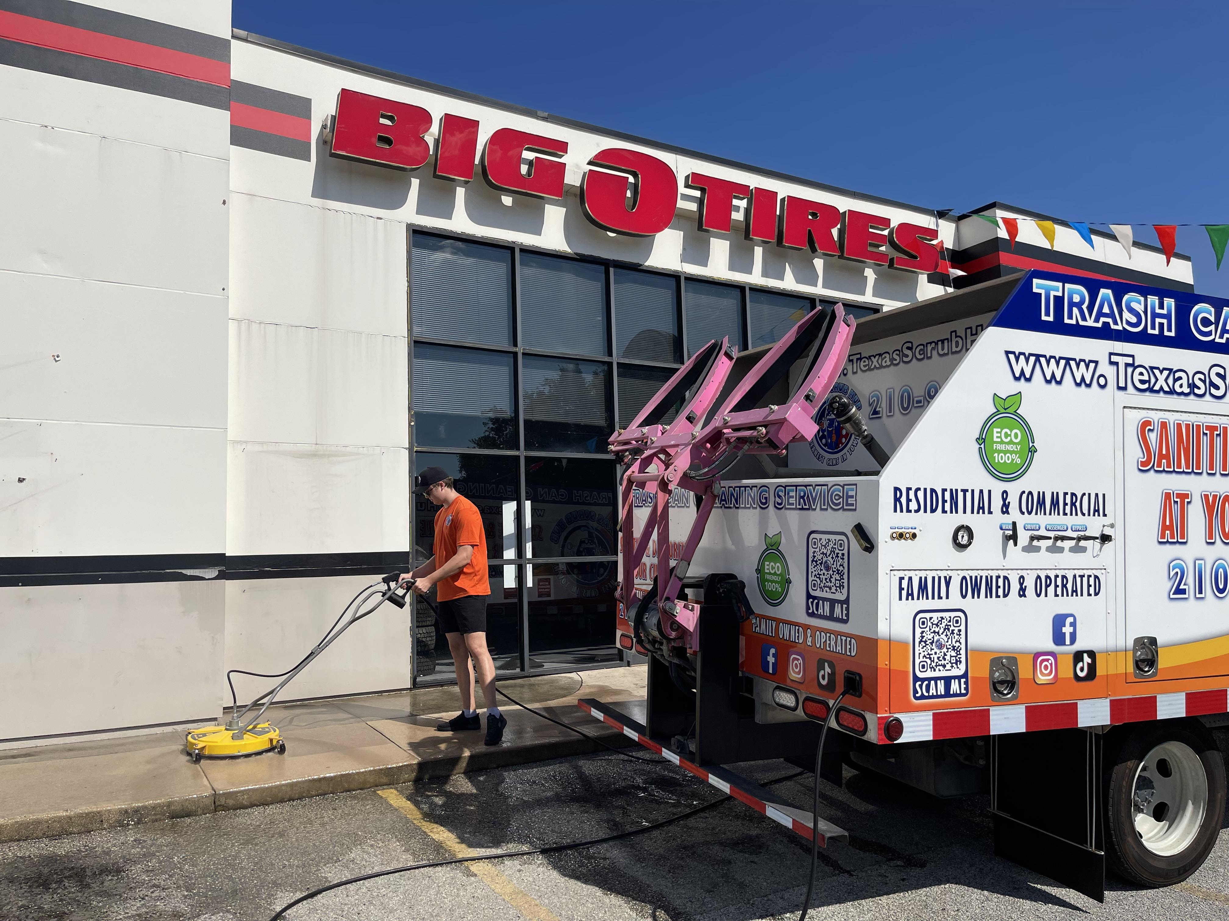 Pressure washing commercial businesses front of a business in San Antonio to remove dirt, stains, and buildup for improved curb appeal.