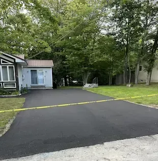 A sealcoated driveway in Ellsworth, Maine that will look good for years