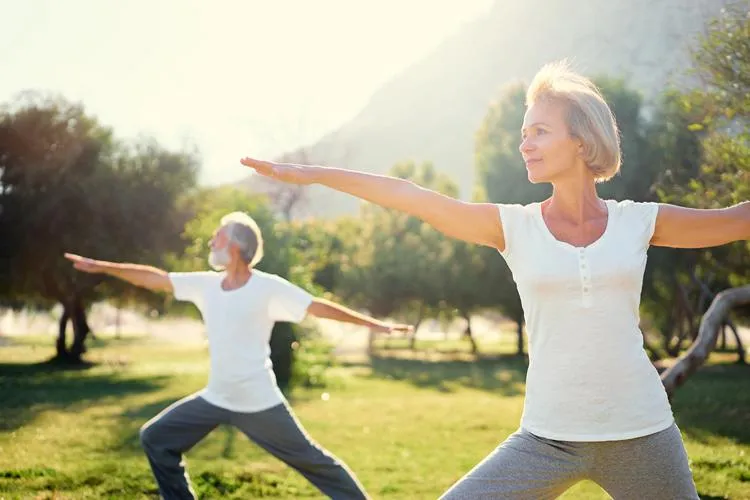 Woman practicing yoga outdoors as part of a holistic treatment for health conditions at Naturopathic Physicians Group in Scottsdale and Phoenix.