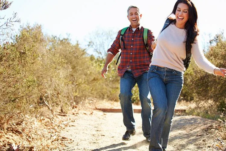 Couple hiking outdoors after personalized gender-specific health treatments at Naturopathic Physicians Group in Scottsdale.