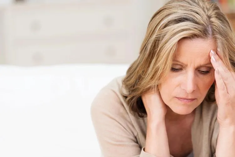 Woman holding her head suffering from fatique Dr. Steven Katz and Dr. Loreena Ryder, naturopathic doctors at Naturopathic Physicians Group in Scottsdale and Phoenix, specializing in personalized care utilizing whole health assessments at Naturopathic Physicians Group in Scottsdale and Phoenix.