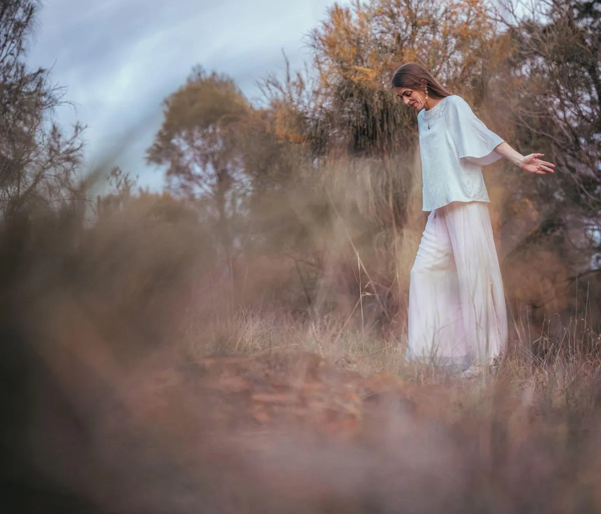 Warm portrait of Arwen or symbolic nature and light imagery with soft mauve and rose tones